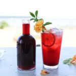 BLACKBERRY COOL 100ML ORANGE JUICE, 10ML PINEAPPLE JUICE, 5CL BLACKBERRY SYRUP, SWEET & SOUR MIX (HURRICANEGLASS